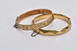 TWO ROLLED GOLD HINGED BANGLES, one with an engraved floral design, the other with a textured