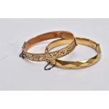 TWO ROLLED GOLD HINGED BANGLES, one with an engraved floral design, the other with a textured