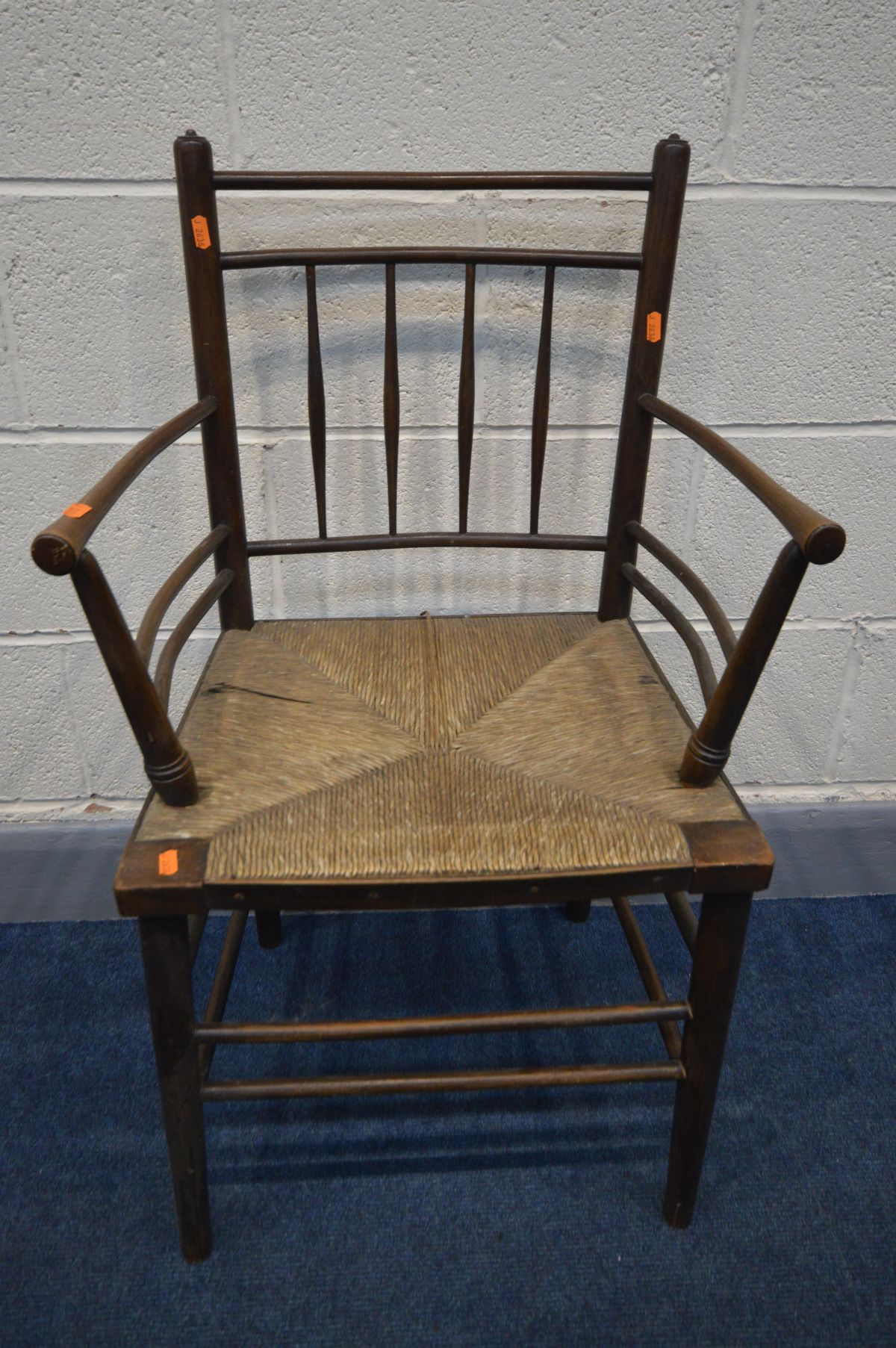 IN THE MANNER OF MORRIS & CO SUFFOLK CHAIR, the back with spindles and horizontal rails, open arm