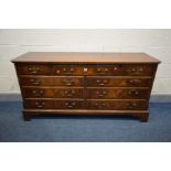 A REPRODUX MAHOGANY AND CROSSBANDED SIDEBOARD/CHEST OF NINE ASSORTED DRAWERS, with drop handles