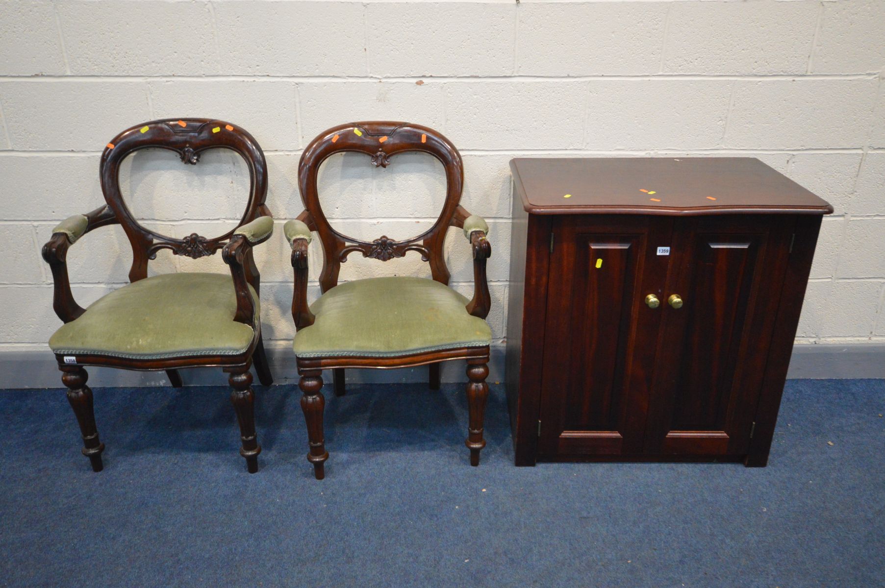 A PAIR OF REPRODUCTION VICTORIAN STYLE ARMCHAIRS, along with a mahogany two door cabinet, width 79cm