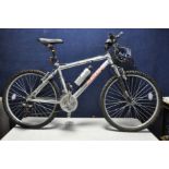 A RALEIGH MUSTANG GENTS MOUNTAIN BIKE with 21 speed twist grip gears , 18in aluminium frame, front