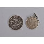 TWO SILVER COINS, the first a mounted George VI 1948 half crown, within a collet and scroll mount,