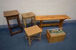 A PINE STOOL, length 121cm, along with an elm stool, stained pine stool, pine stool and a pine