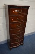 A TALL MAHOGANY SERPENTINE CHEST OF SEVEN DRAWERS, labelled 'Knechtel Furniture', width 56cm x depth