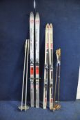 A PAIR OF HEAD 360 SKIS, a pair of Atomic Mid 175 skis, two sets of poles and two pairs of ski boots