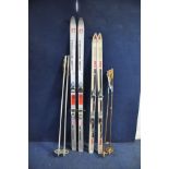 A PAIR OF HEAD 360 SKIS, a pair of Atomic Mid 175 skis, two sets of poles and two pairs of ski boots