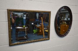 A GILTWOOD BEVELLED EDGE WALL MIRROR, 92cm x 71cm and an oval mirror (2)