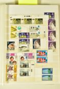 A COLLECTION OF STAMP in a large stockbook with mint GB QEII including some face valuem, main