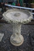 A TREE EFFECT COMPOSITE BIRD BATH, on a separate base, diameter 50cm x height 76cm