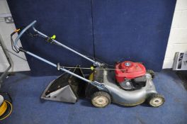 A HONDA i2Y PETROL SELF PROPELLED LAWN MOWER with grass box ( engine pulls freely but hasn't been