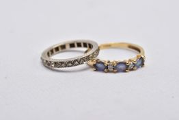 A 9CT GOLD IOLITE AND DIAMOND RING AND A FULL ETERNITY RING, the first designed with three oval