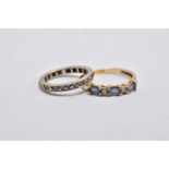 A 9CT GOLD IOLITE AND DIAMOND RING AND A FULL ETERNITY RING, the first designed with three oval