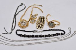 A BAG OF COSTUME JEWELLERY, to include a black faceted bead necklace fitted with a white metal