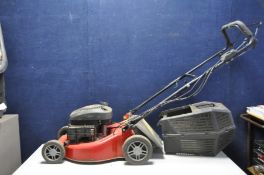 A CHAMPION SELF PROPELLED PETROL LAWN MOWER with grass box (engine pulls freely but hasn't been