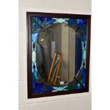 A WOOD FRAMED TIFFANY STYLE WALL MIRROR, the central mirror panel is surrounded by a repeat