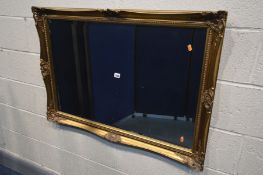 A GILTWOOD BEVELLED EDGE WALL MIRROR, 104cm x 74cm