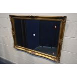 A GILTWOOD BEVELLED EDGE WALL MIRROR, 104cm x 74cm