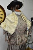 A LATE VICTORIAN GREY SILK TWO PIECE DRESS, with brown silk fringing, the skirt with stains/