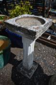 A COMPOSITE SQUARE TOPPED BIRD BATH, on square reeded support, later painted white, 35cm squared x