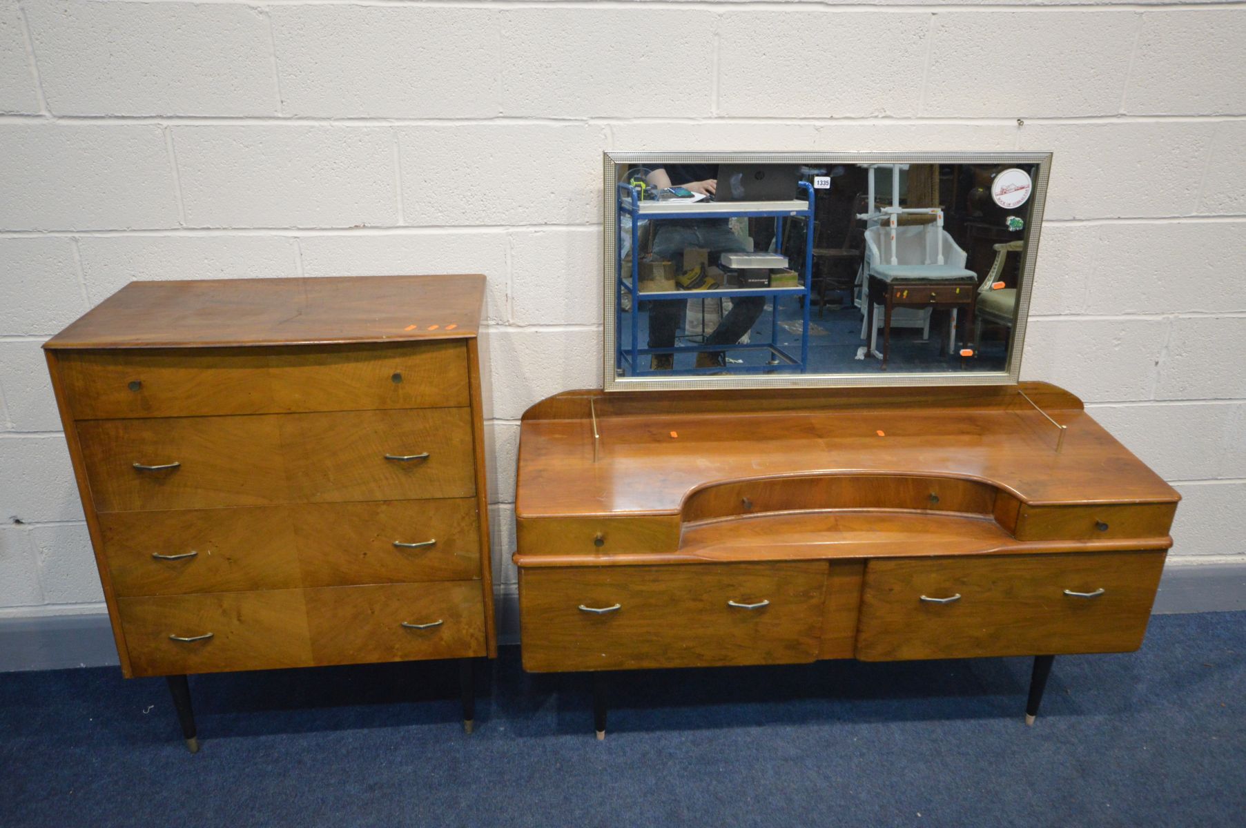 A MID 20TH CENTURY WALNUT TWO PIECE BEDROOM SUITE, comprising a dressing table (missing two caps and