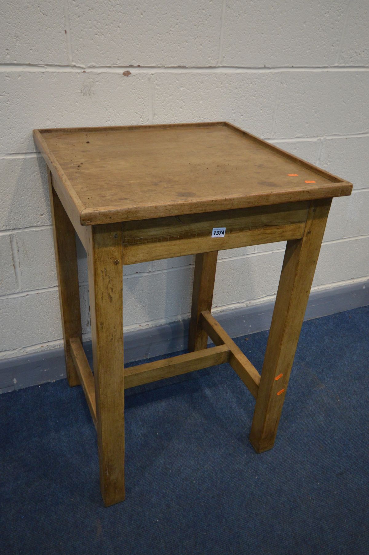 A TALL PINE SQUARE TABLE, on block legs united by a stretcher, 61cm squared x height 92cm