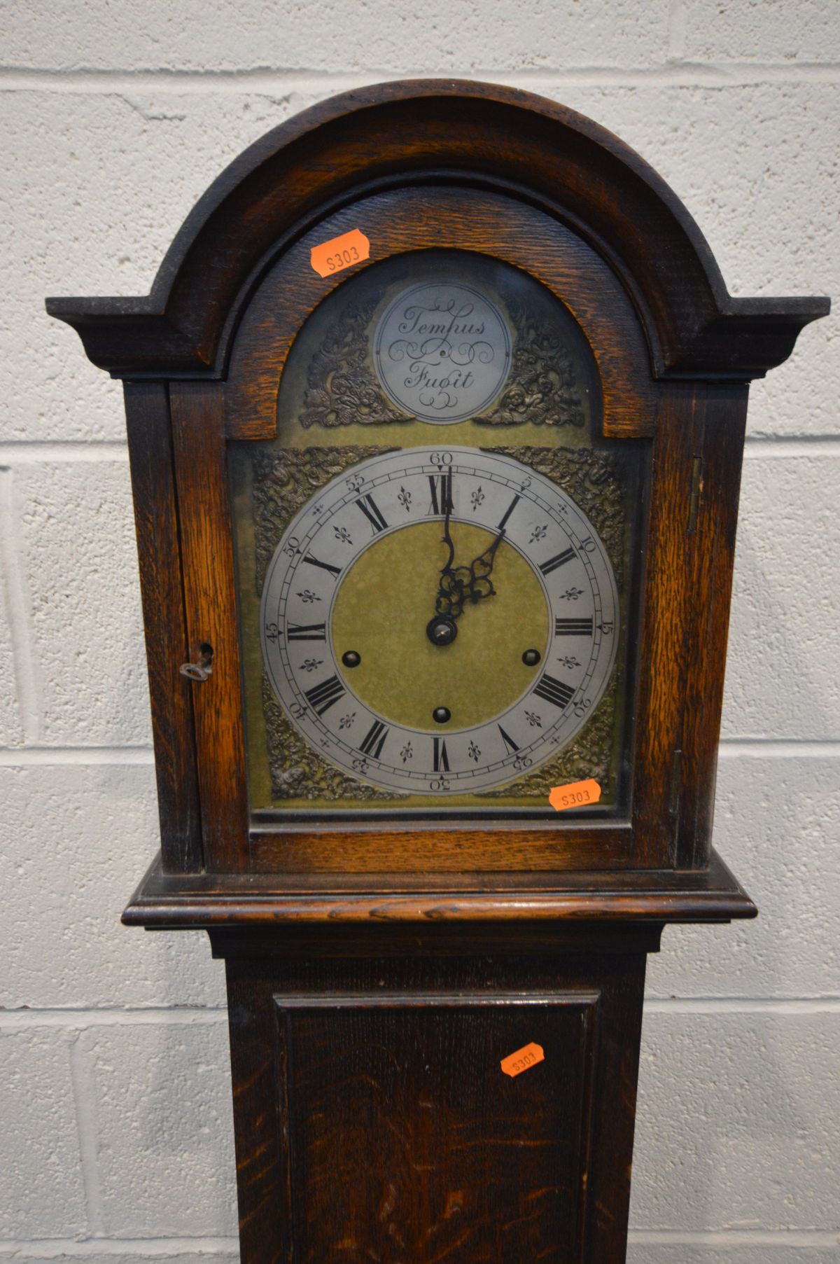 AN OAK GRANDDAUGHTER CLOCK, brass and silvered 6 inch dial with an Enfield movement, and tempus - Image 2 of 2