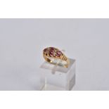 A VICTORIAN DIAMOND AND RUBY BOAT RING, set with four circular cut rubies, interspaced with four