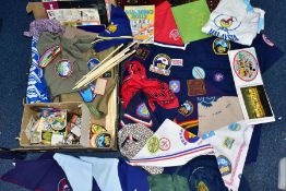 A COLLECTION OF BADGES AND PATCHES OF SCOUTING MEMORABILIA, shirts, neckerchiefs, etc, much of it