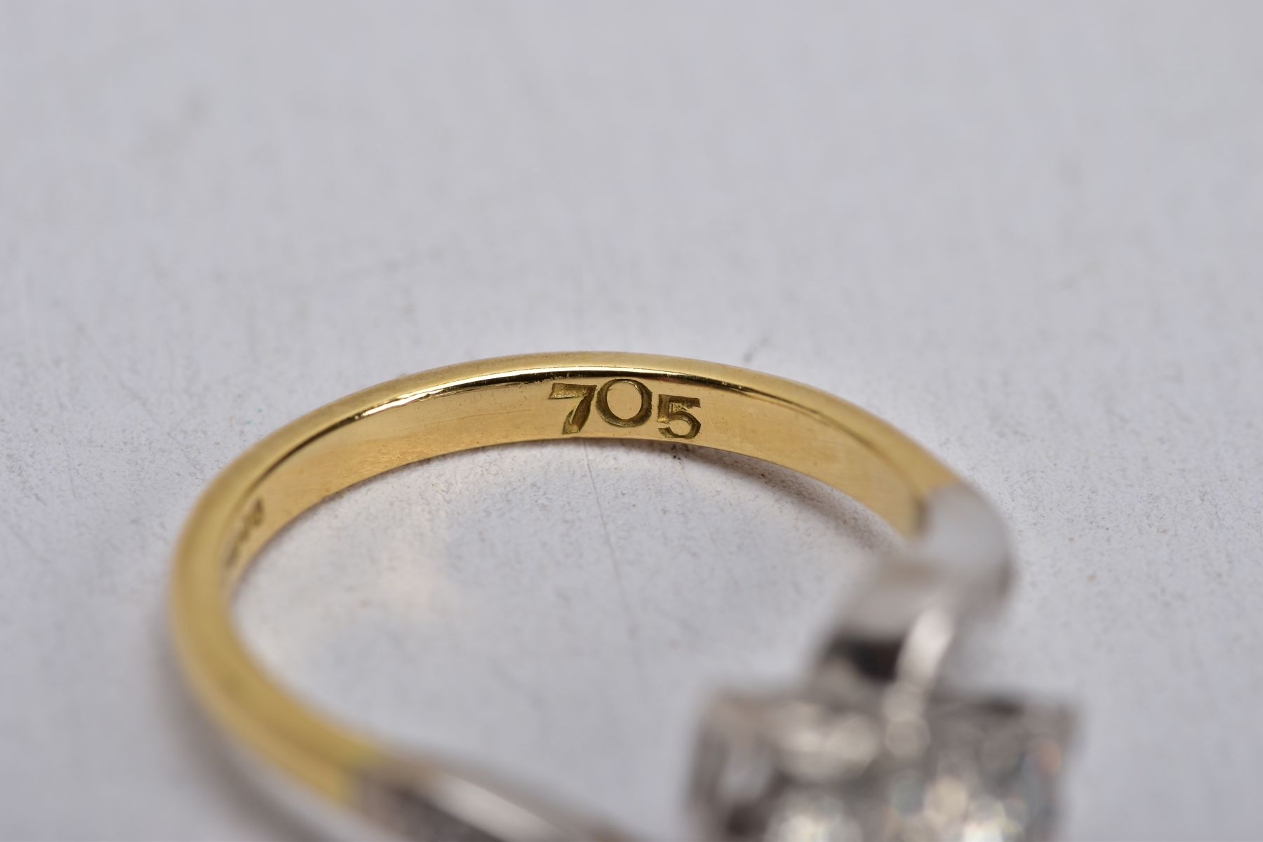 AN 18CT GOLD DIAMOND CROSS OVER RING, designed with two asymmetrical set round brilliant cut - Image 6 of 6