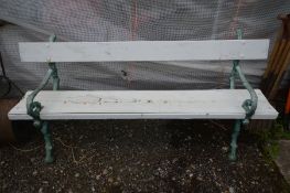 A HEAVY CAST IRON GARDEN BENCH, the ends in the form branches, later painted, length 180cm