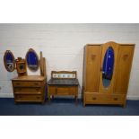 AN EARLY 20TH CENTURY MATCHED TWO PIECE BEDROOM SUITE comprising a single door wardrobe with a