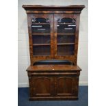A VICTORIAN FLAME MAHOGANY BOOKCASE, the marriage top with a fixed cornice above double glazed