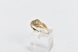 A 9CT GOLD EMERALD AND DIAMOND RING, centring on a circular cut emerald, within single cut diamond