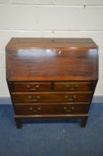 A GORDON RUSSELL OF BROADWAY MAHOGANY BUREAU, with a fall front door enclosing a fitted interior,