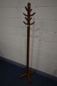 AN 'ABBESS' OAK COAT STAND, height 177cm