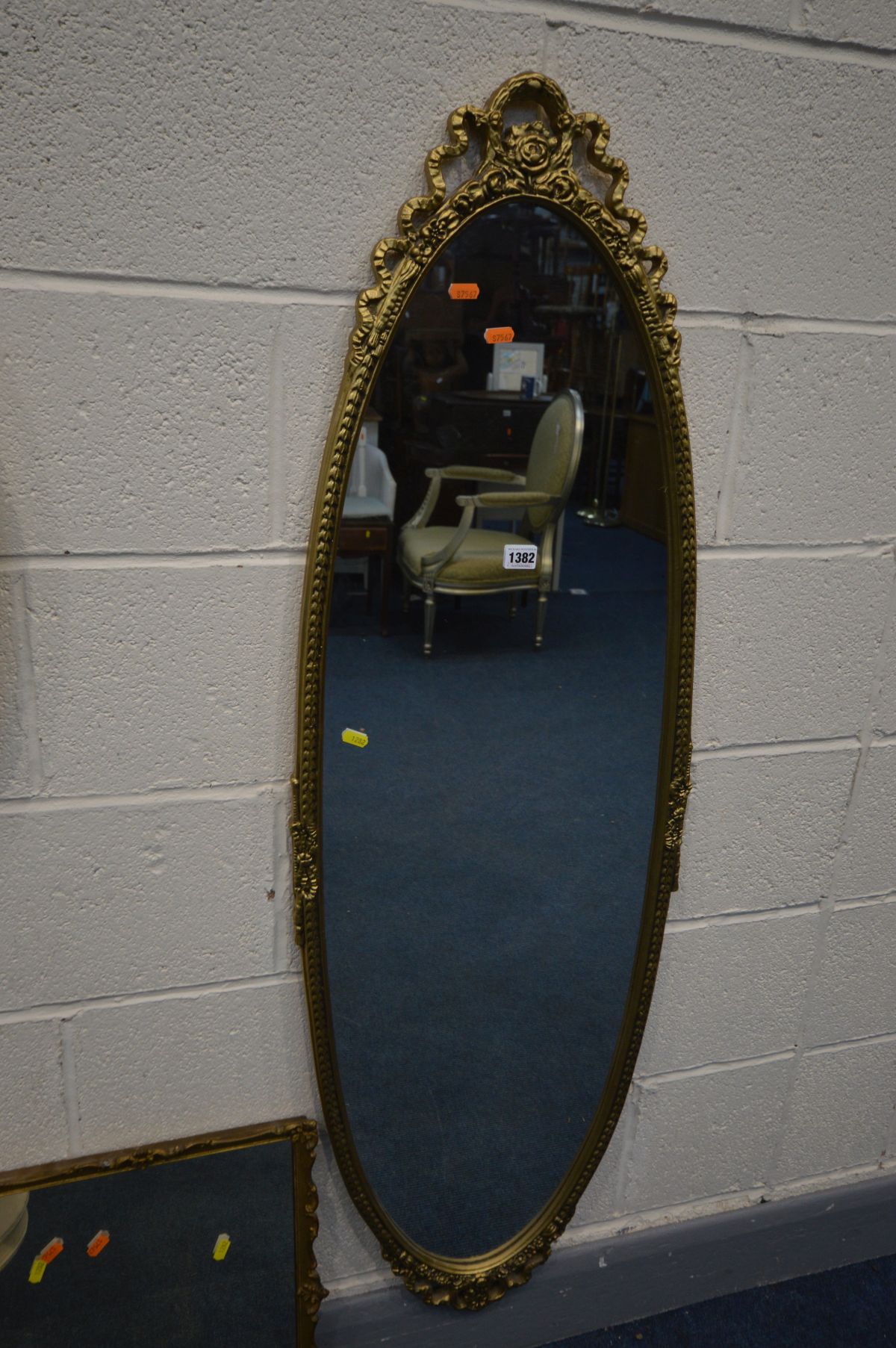 AN OVAL FOLIATE GILT WOOD WALL MIRROR, another gilt mirror and another mirror, along with two - Image 2 of 3