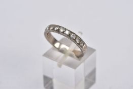 A WHITE METAL DIAMOND HALF ETERNITY RING, designed with a row of ten round brilliant cut diamonds,