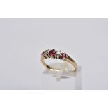 A 9CT GOLD RUBY AND DIAMOND RING, designed with three graduated circular cut rubies, interspaced