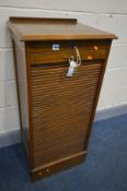 AN OAK TAMBOUR FRONT FILING CABINET, enclosing nine beech drawers, width 48cm x depth 42cm x