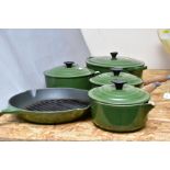 FIVE LE CREUSET GREEN ENAMELLED PANS, comprising a graduated set of three saucepans with lids, 16cm,