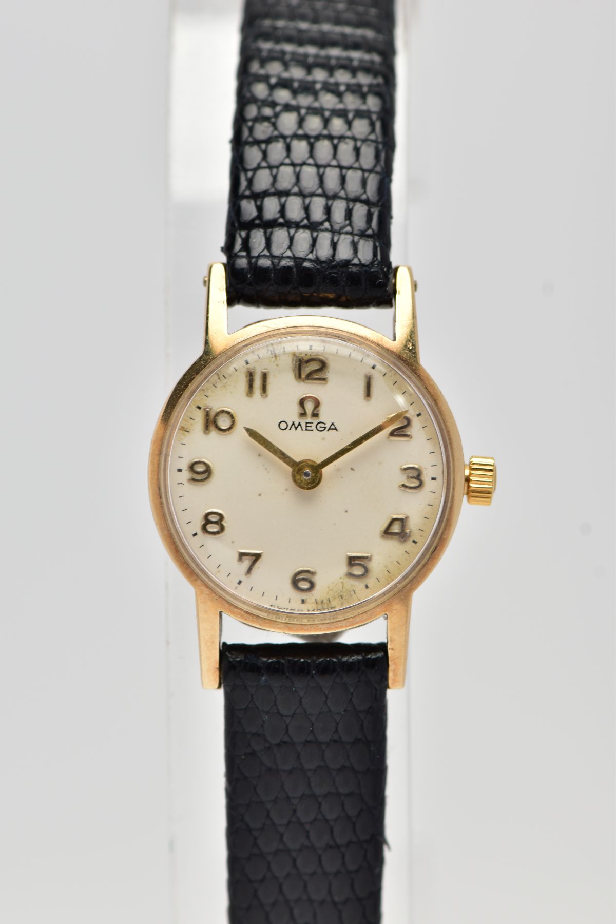 A LADIES 9CT GOLD 'OMEGA' WRISTWATCH, circa 1960's, hand wound movement, round champagne dial signed