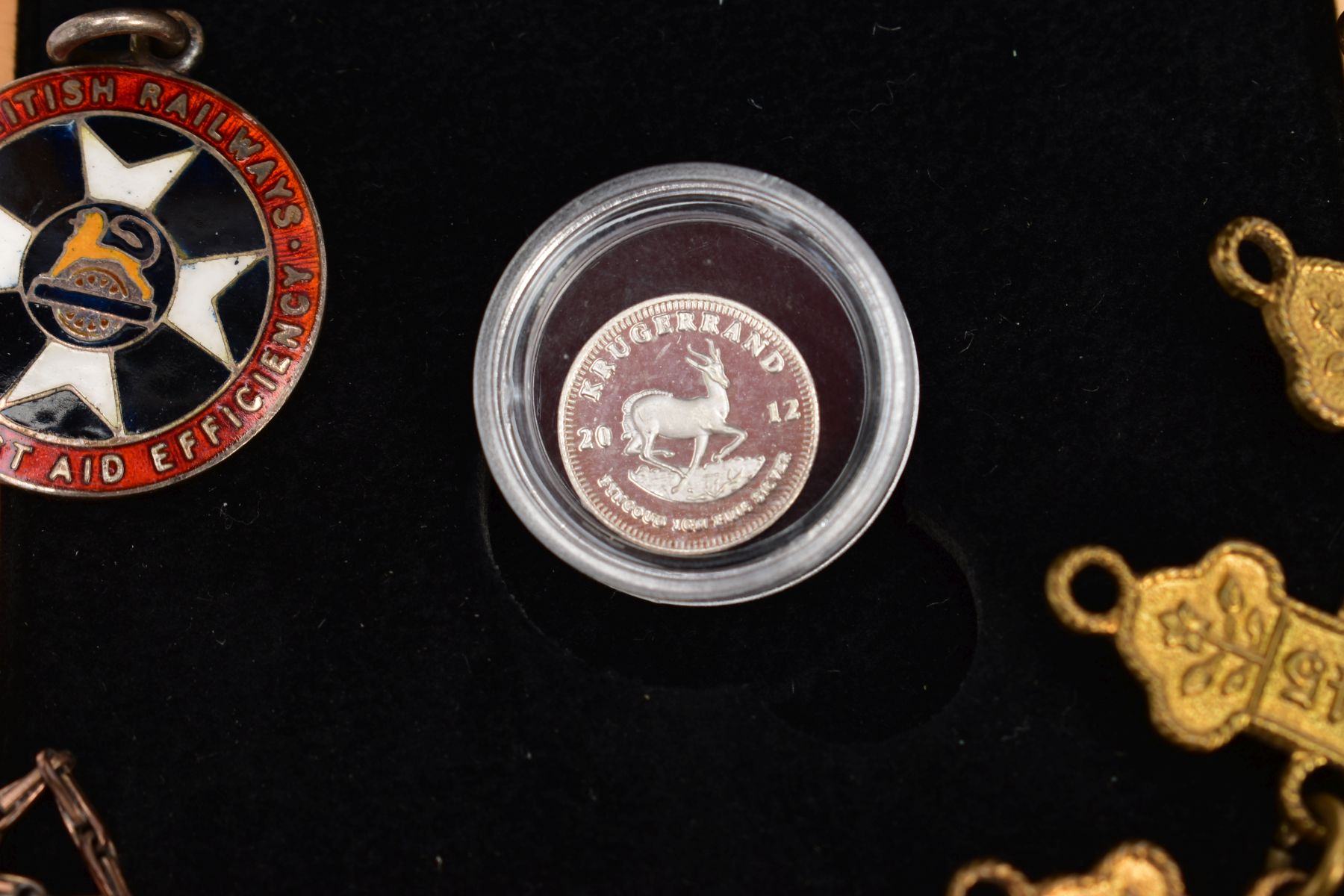 A SMALL PACKET OF ITEMS to include a boxed 20th/ounce silver Krugerrand, a 12 year St Johns - Image 2 of 4