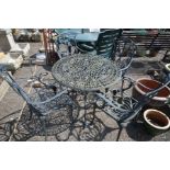 A BLACK ALUMINIUM CIRCULAR GARDEN TABLE, diameter 86cm x height 71cm and four armchairs (5)