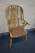 A BEECH SPINDLE BACK WINDSOR ARMCHAIR with a crinoline stretcher