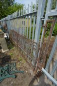 A WELL RUSTED CAST IRON DOUBLE DRIVEWAY GATES, and supports, length with supports 355cm x height