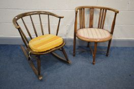 AN ERCOL MODEL 339 COWHORN ROCKING CHAIR (worn arms) along with an Edwardian armchair with an arched