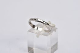 A PLATINIUM DIAMOND ETERNITY RING, plain polished band set with eight round brilliant cut