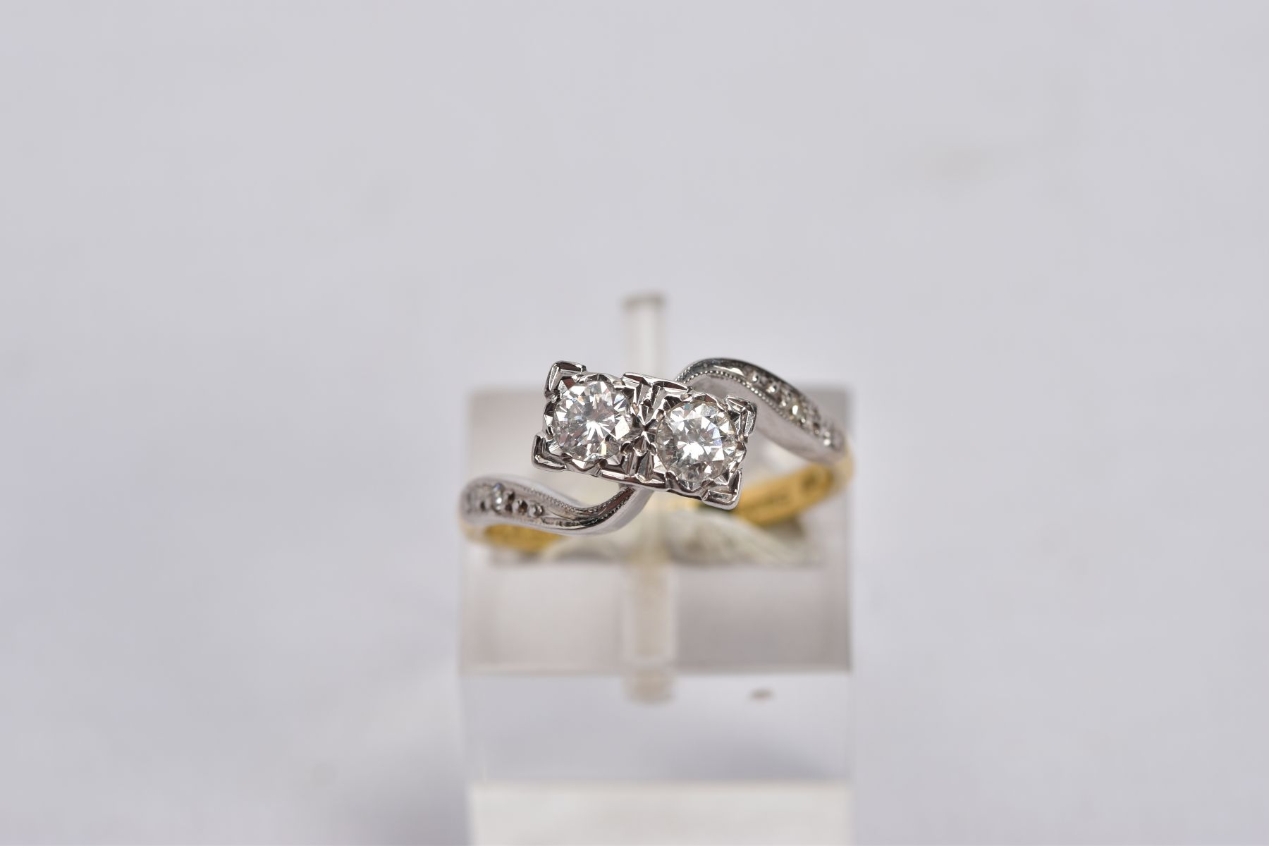 AN 18CT GOLD DIAMOND CROSS OVER RING, designed with two asymmetrical set round brilliant cut - Image 4 of 6