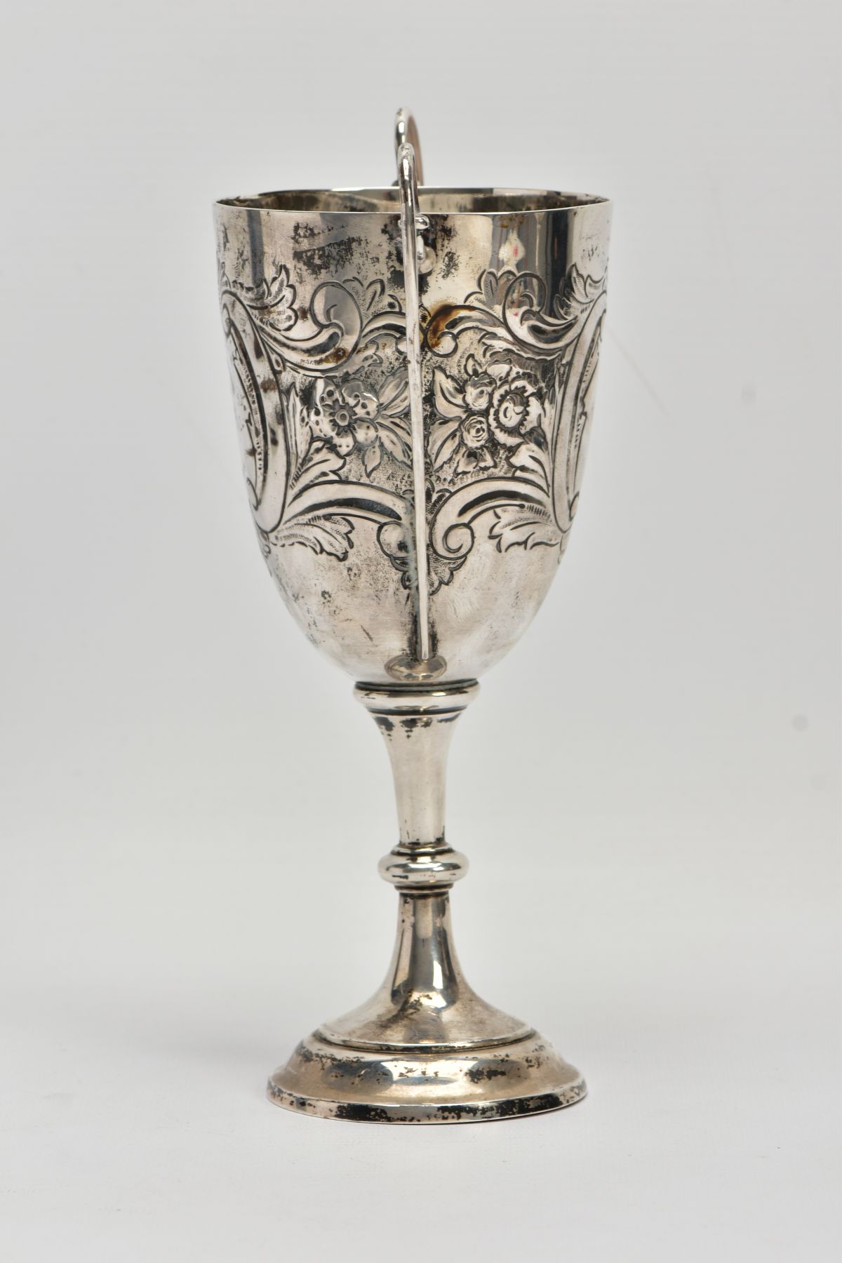 A SILVER TROPHY CUP, double scroll handles, embossed floral and foliate design, with a vacant - Image 4 of 7